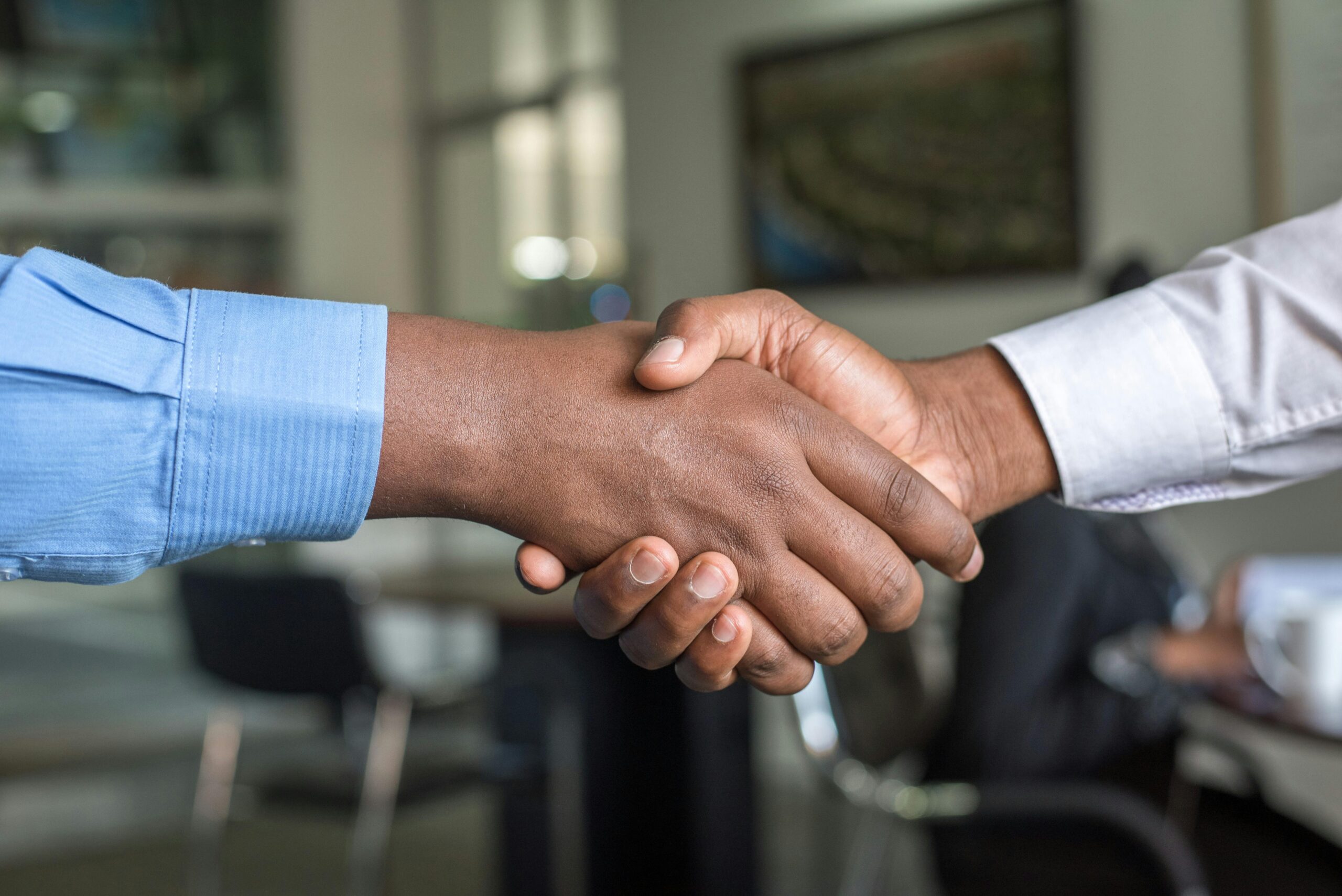 pexels-cytonn-955395 (21) two people in dress shirts shaking hands