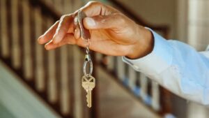 someone holding up a house key
