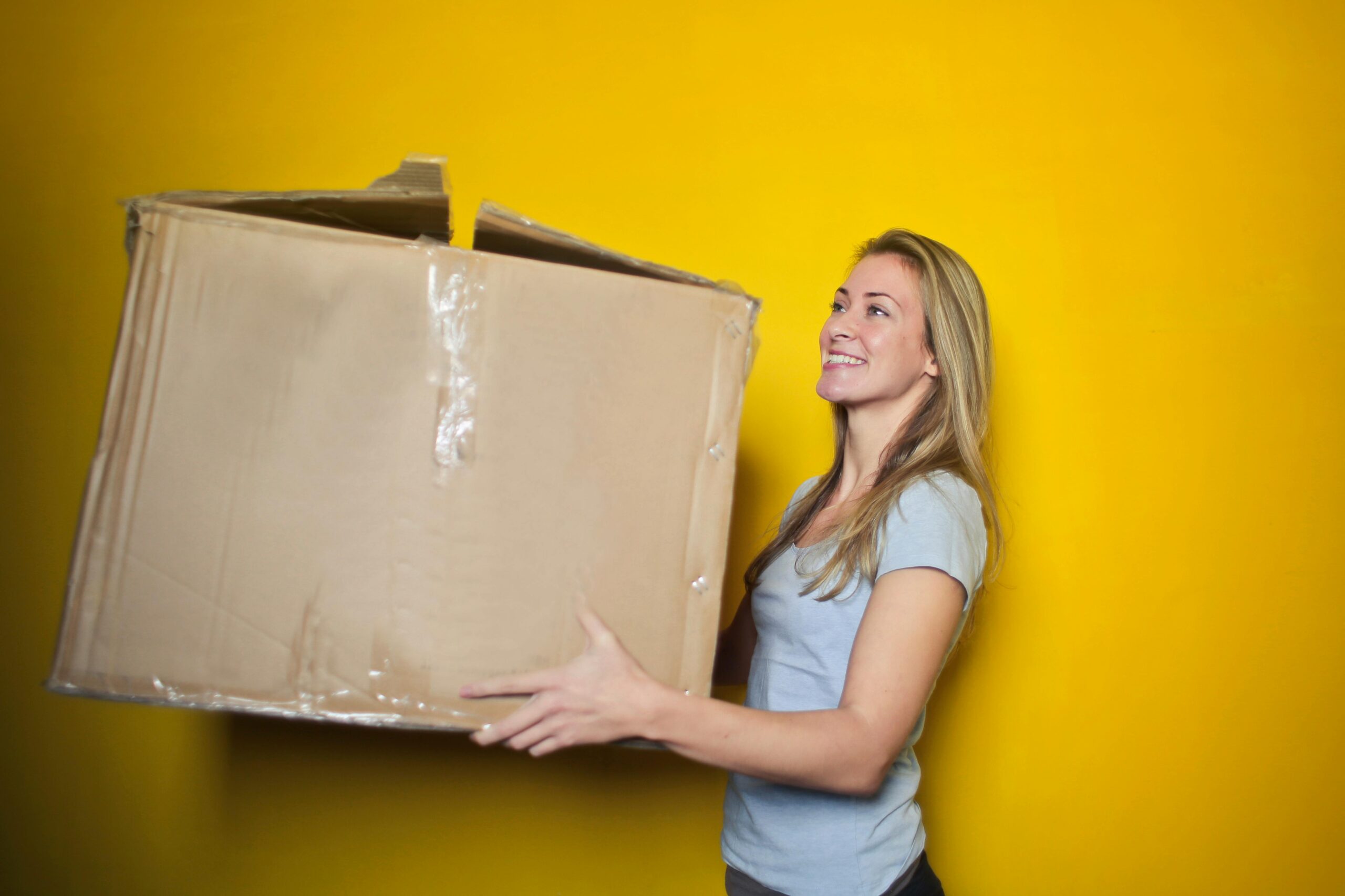 pexels-olly-761999 (5) woman holding moving box