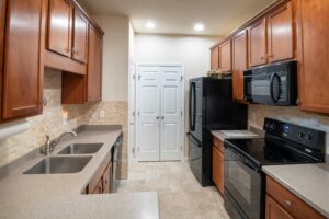 a kitchen with wooden cabinets