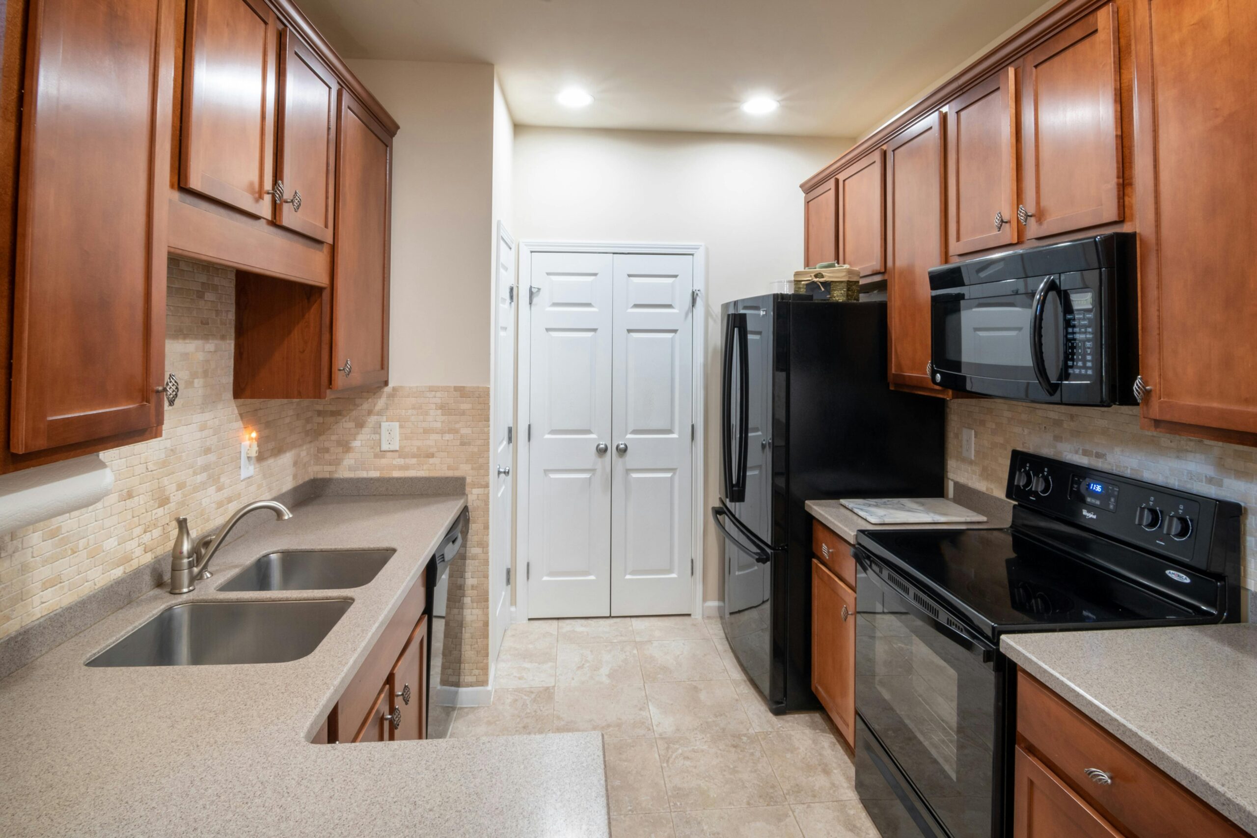 pexels-curtis-adams-1694007-4119836 (1) a kitchen with wooden cabinets