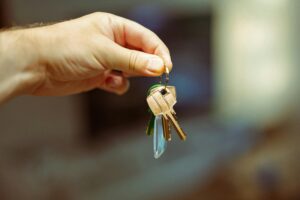 someone holding up house keys