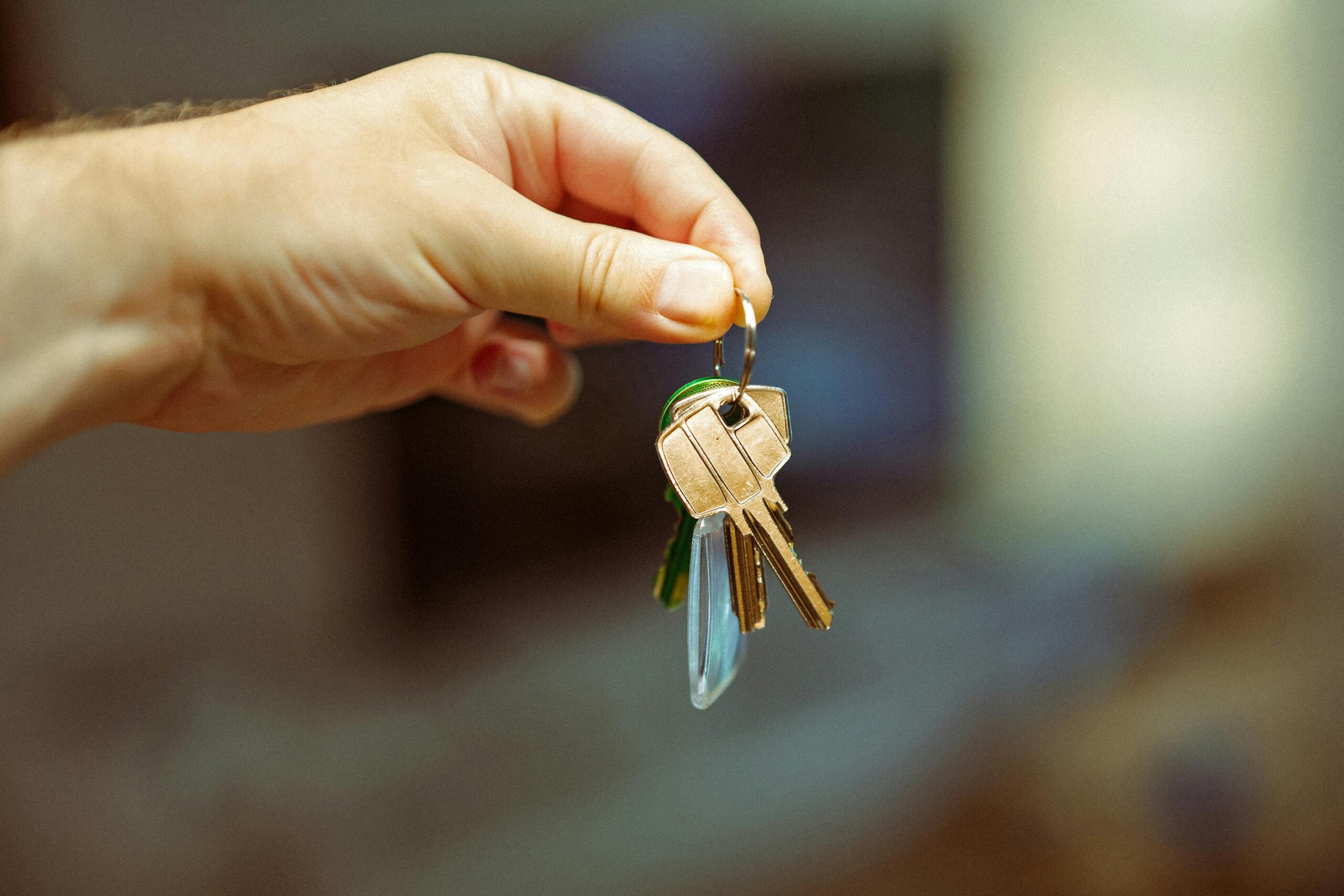 someone holding up house keys