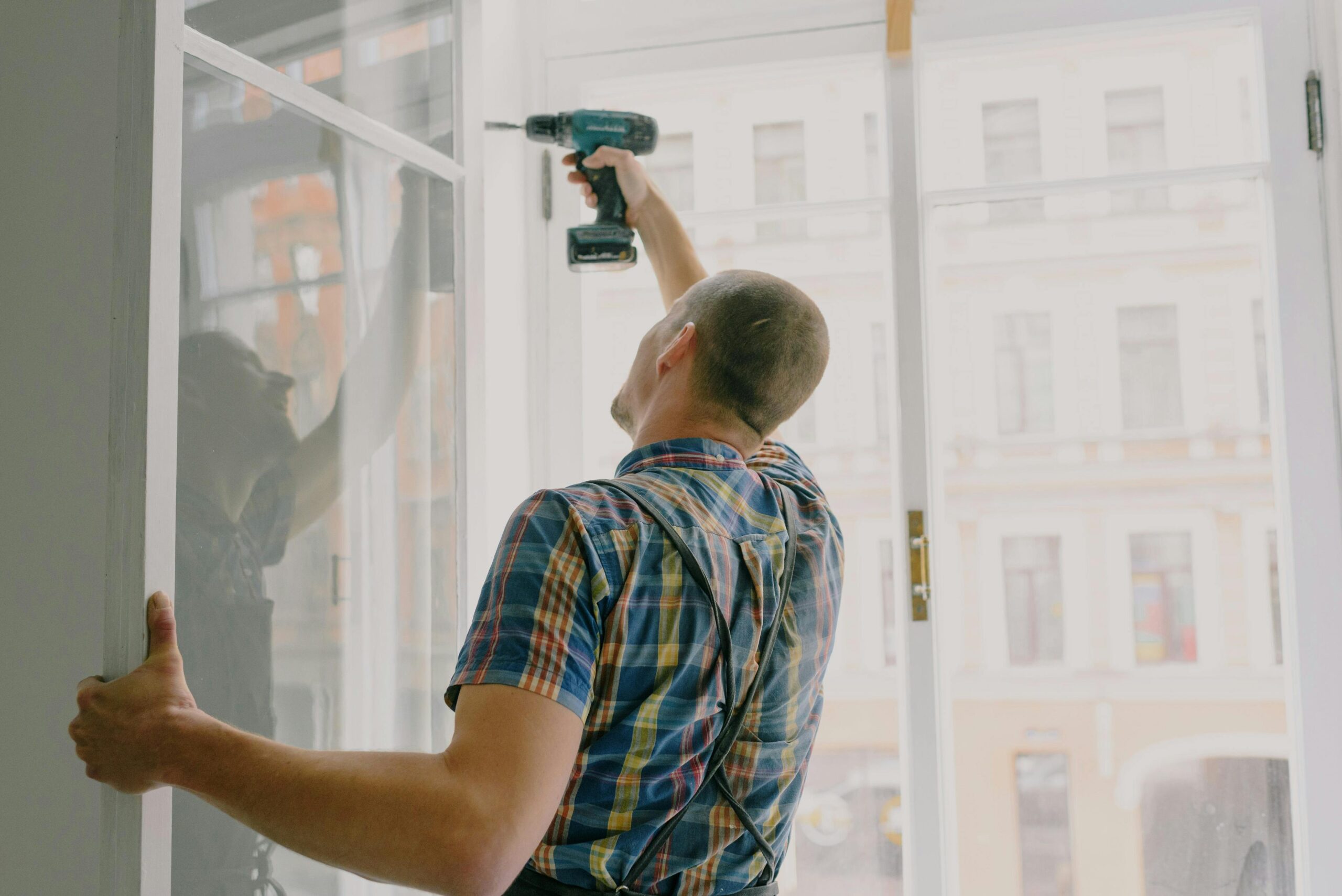 pexels-kseniachernaya-5691544 (20) man drilling into an open window pane