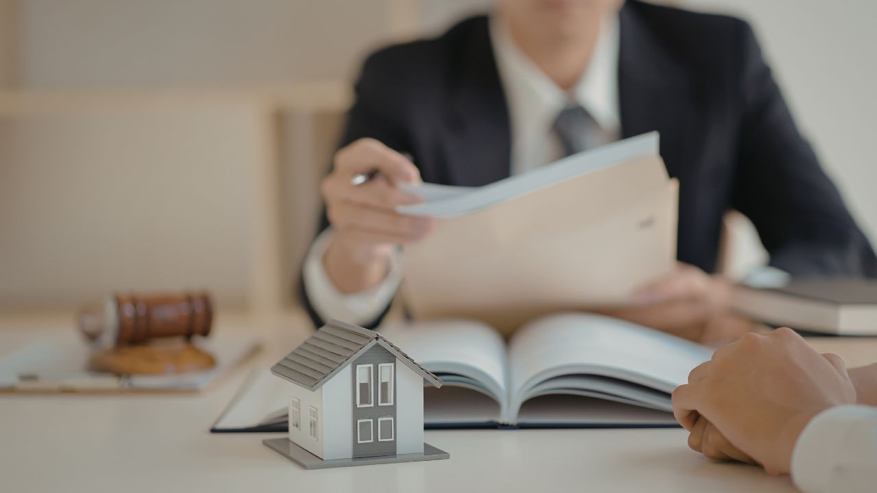 Property manager reviewing lease documents with tenant
