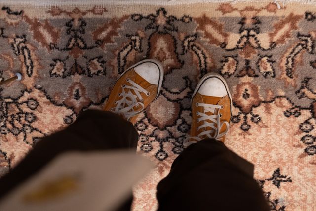 a person standing on a carpet