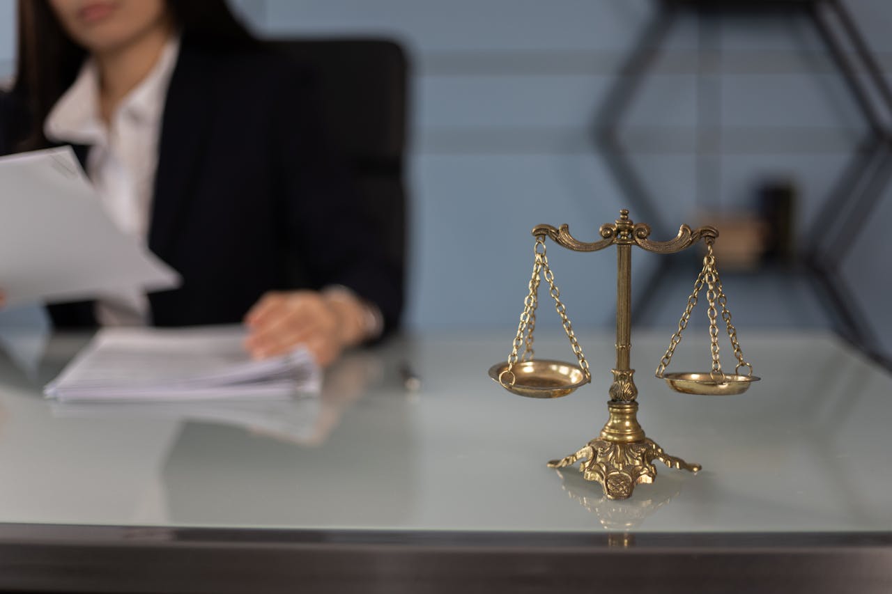 legal scales and person looking at papers